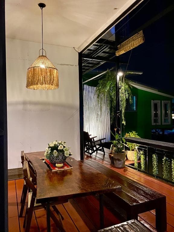 Evening deck dining with pendant lights